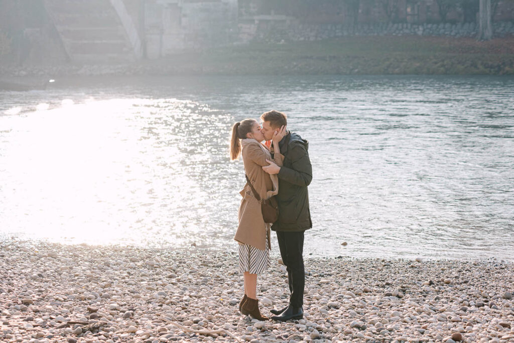 Full body portrait of couple at Castelvecchio bridge Verona