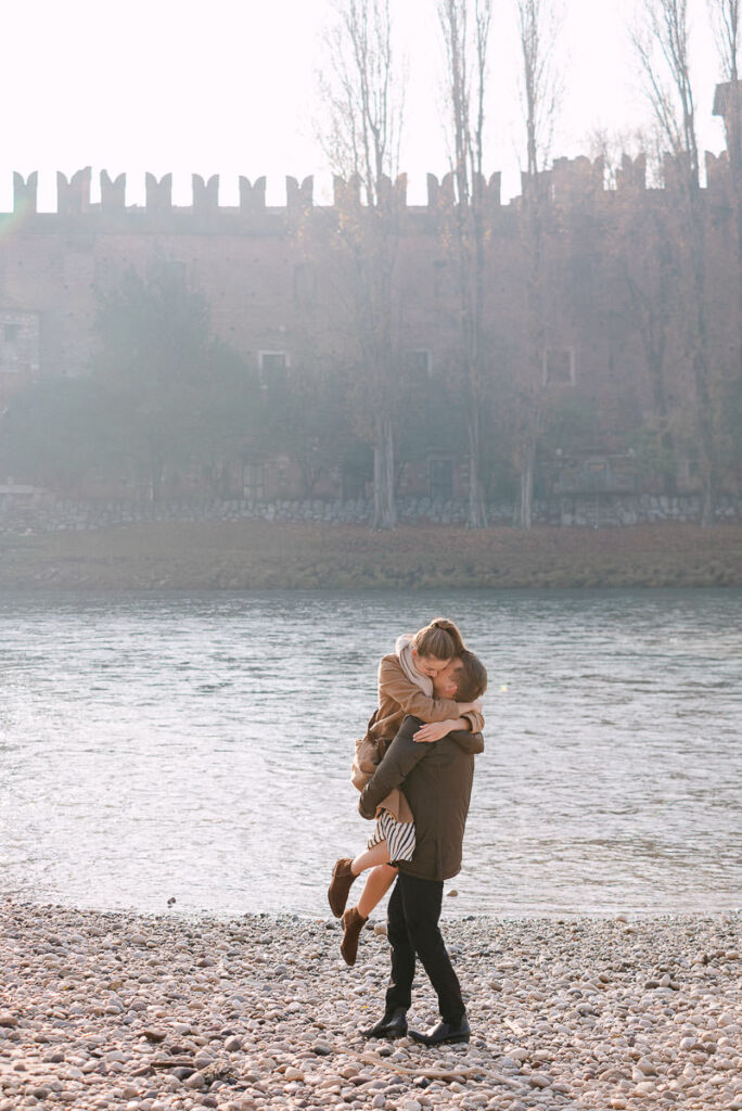Couple walking together after proposal in Verona Italy