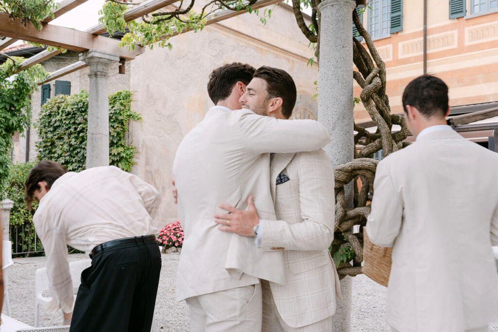 Guests arriving at ceremony overlooking Lake Com