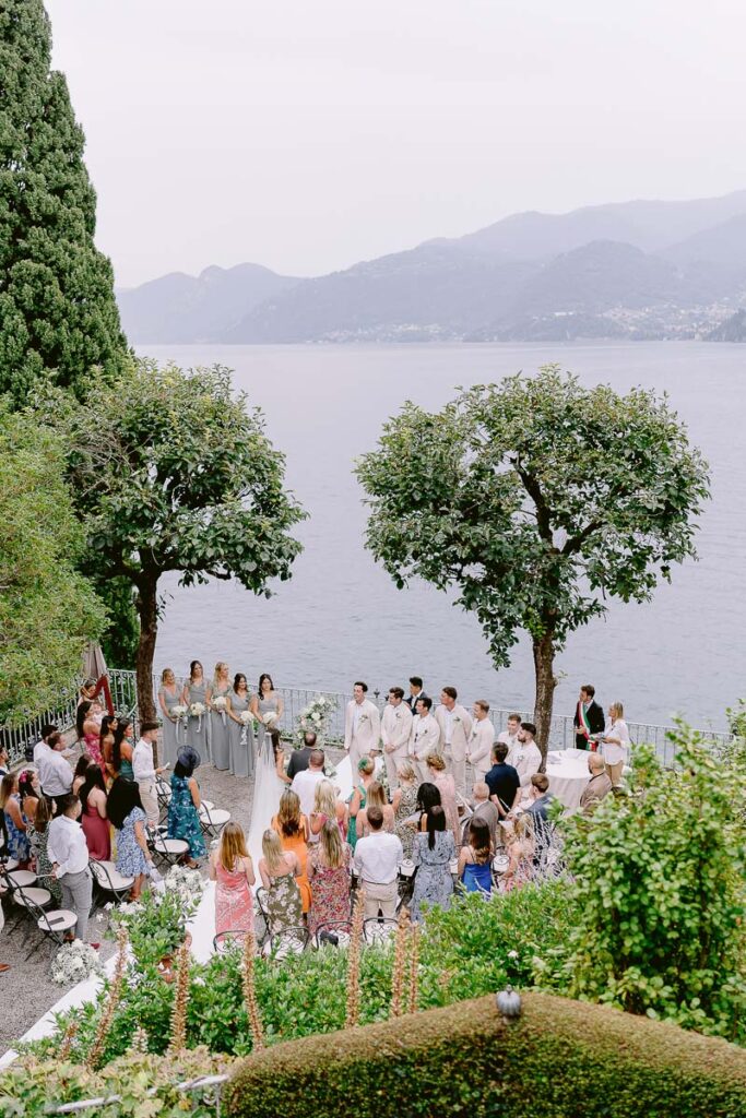 Wedding guests seated for ceremony overlooking lake