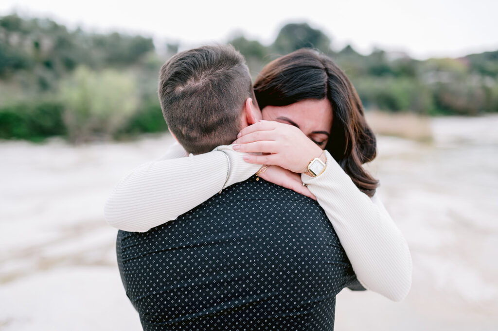 Emotional embrace after a marriage proposal photographed near Lake Garda, Verona
