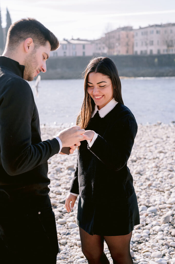 A joyful ring moment during a Lake Garda proposal photoshoot near Verona